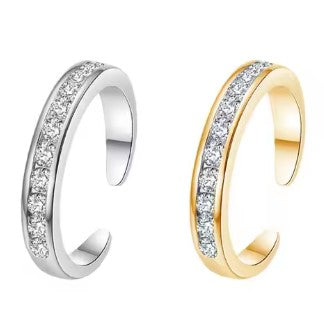 Two waterproof  "Cascade" diamantie toe rings, one with a silver finish and the other with a gold finish, both featuring adjustable bands and lined with sparkling zirconia gems.