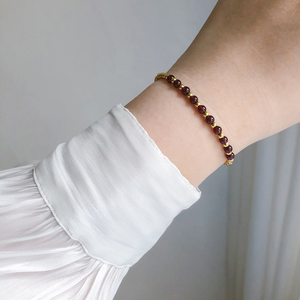 Natural garnet elastic bracelet with 18K PVD gold plated stainless steel details
