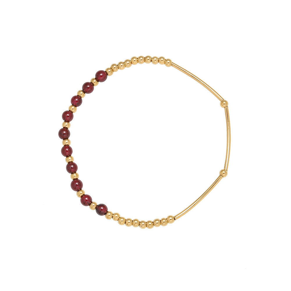 Gazania garnet bracelet with gold stainless steel beads on white background