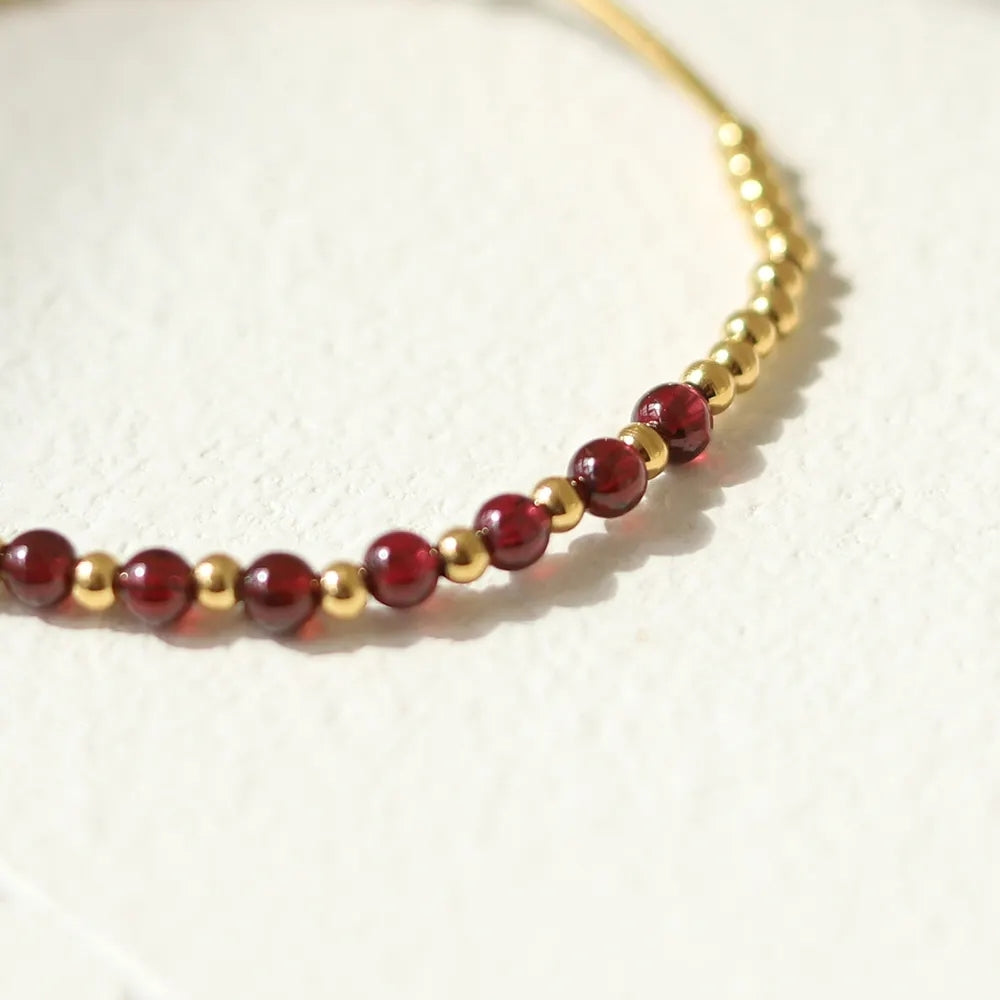 Waterproof garnet bead bracelet with gold stainless steel accents