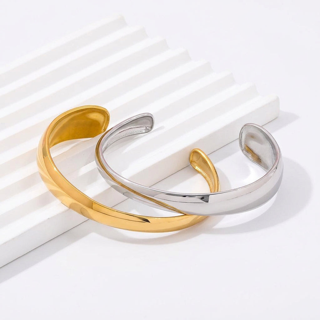 Gold and silver Magnolia statement cuff bracelets