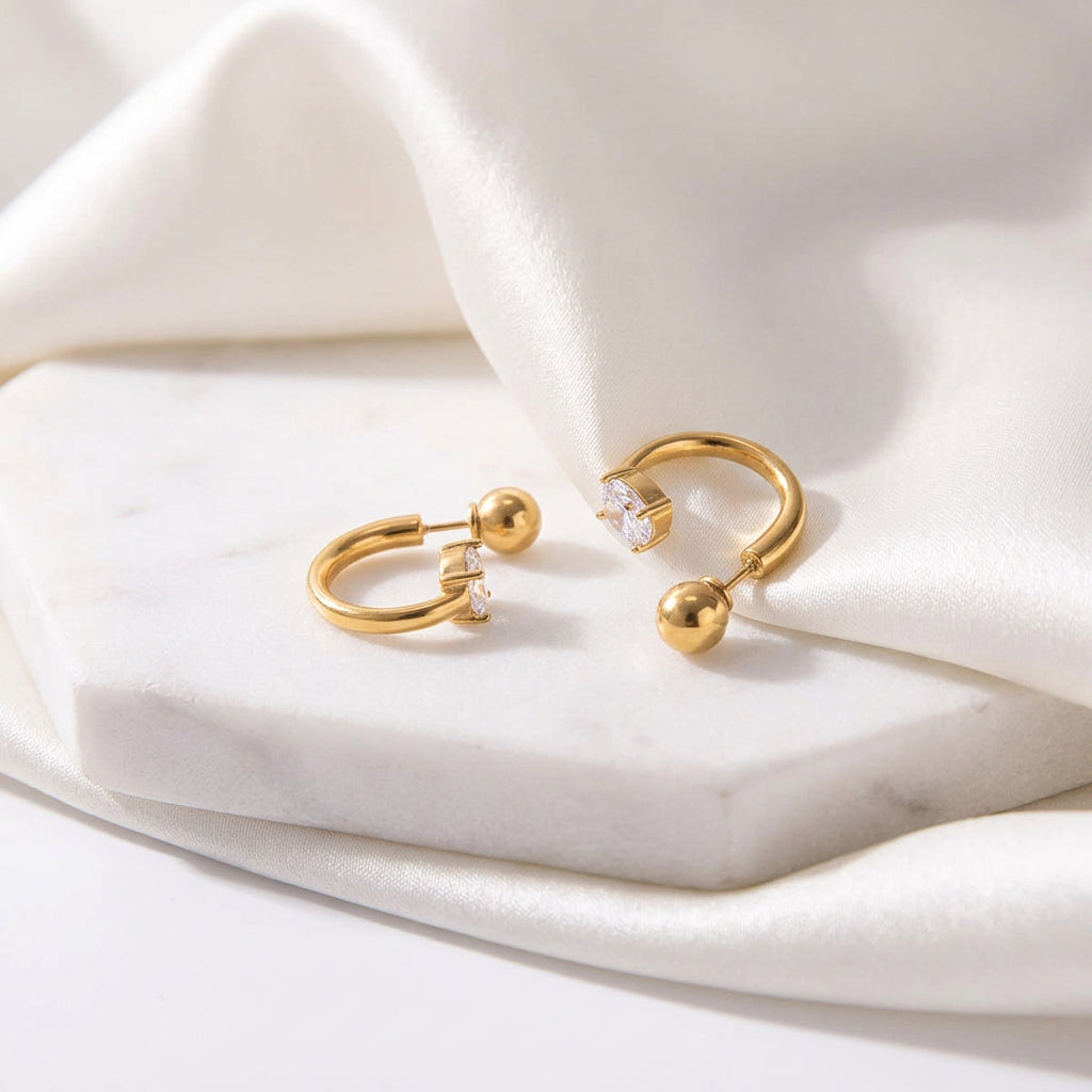 Delicate gold CZ huggie earrings by Wyldflower Jewellery