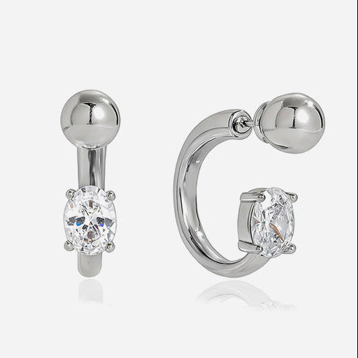 Small gold huggie earrings with clear stone drops