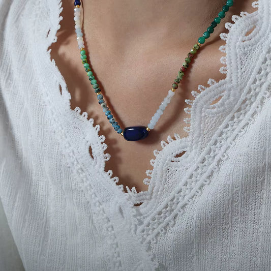 Violet bead necklace close-up showing natural agate crystals